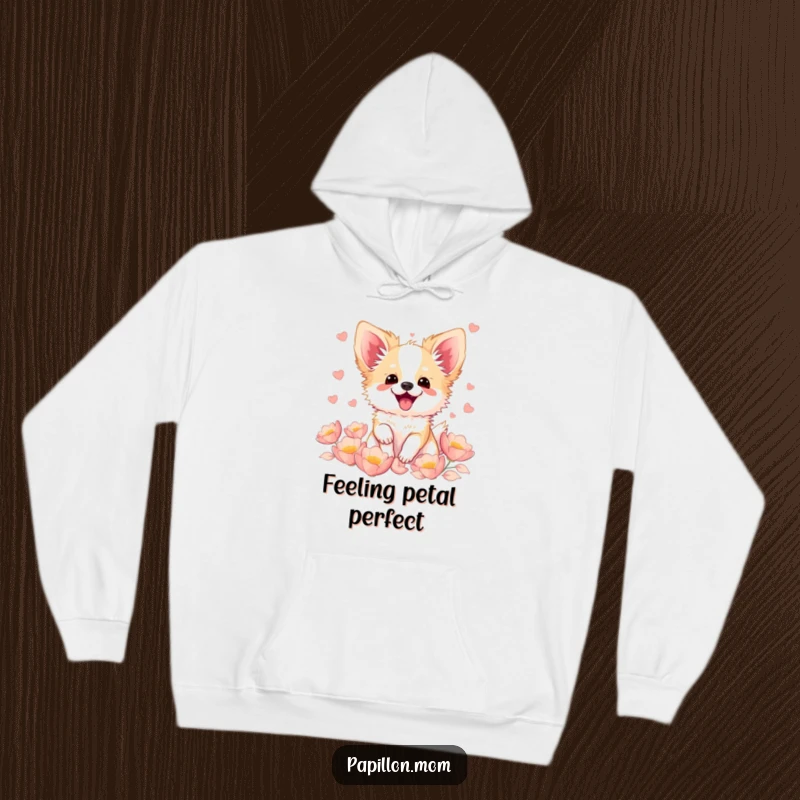 Funny Kawaii Papillon dog hoodie, an illustration of a French butterfly dog fluttering with excitement, surrounded by a gentle scattering of soft petals.