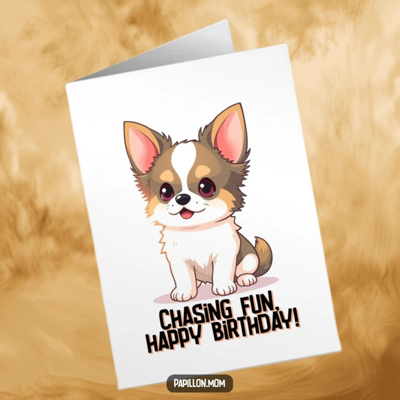 Funny Free Printable Birthday Card: Kawaii Papillon dog with delicate ears perked, chasing a light beam with playful focus.