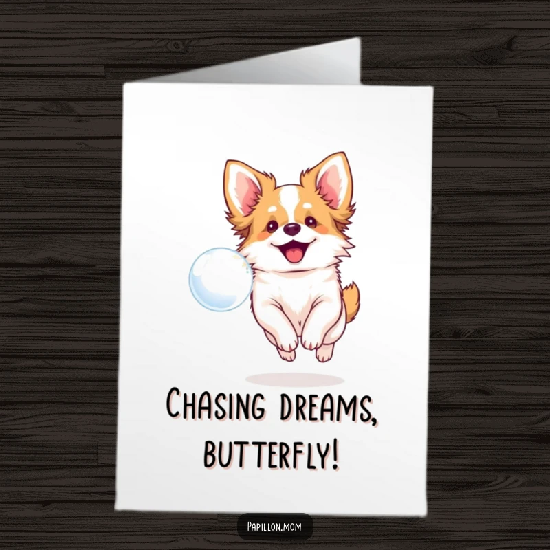 Funny Free Printable Congratulations Card: A cheerful Papillon dog with a big smile chasing a bubble, perfect for congratulations.
