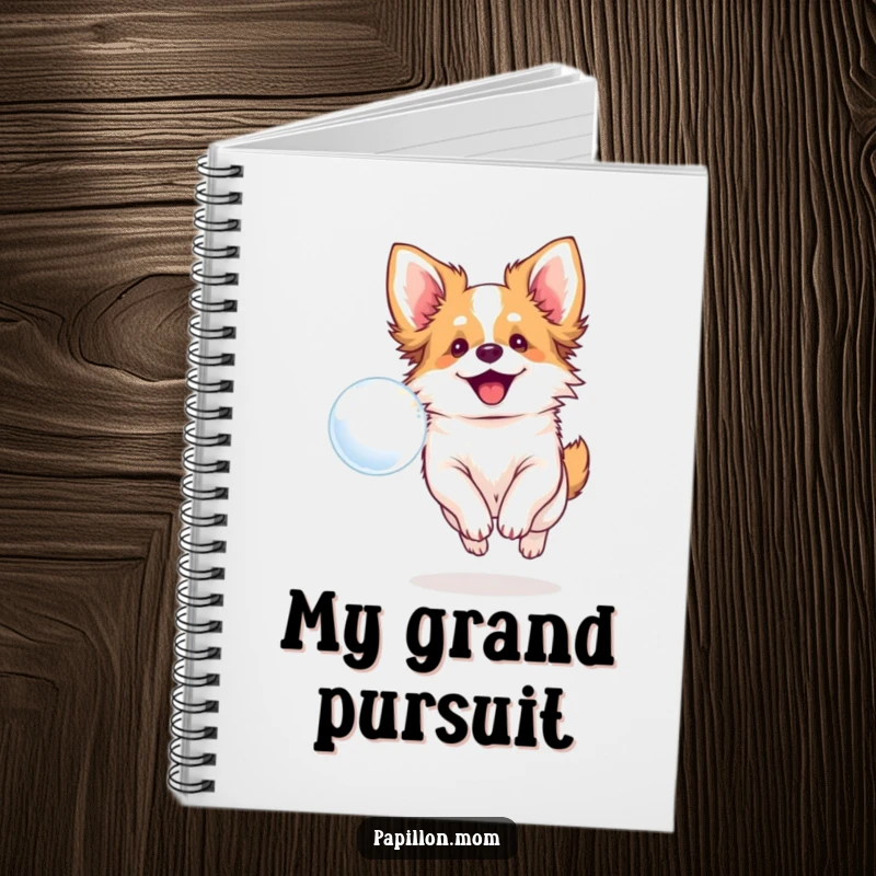Funny notebook with a smiling Papillon dog chasing a bubble, perfect for jotting down thoughts happily.